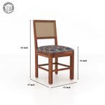 Wooden chair with wicker backrest and patterned cushion, shown with dimensions on a white background. - Honey
